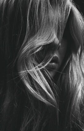 grayscale photo of womans face